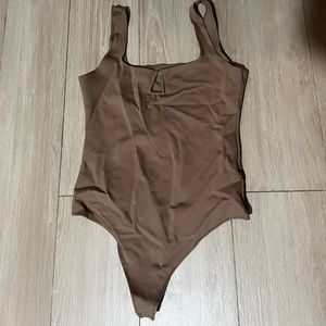 Abercrombie size L thong style bodysuit tan never worn